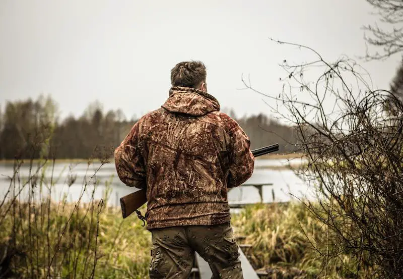 duck hunter by a lake