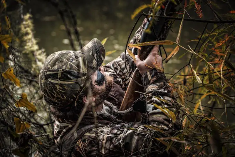 Man hunting ducks in camouflage