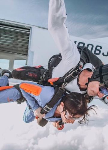 Florida Skydiving Instructor jumping in tandem from a white plane