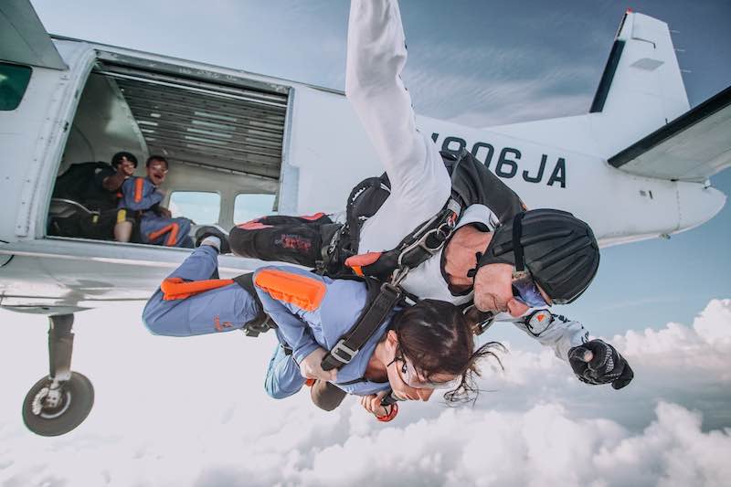 Florida Skydiving Instructor jumping in tandem from a white plane