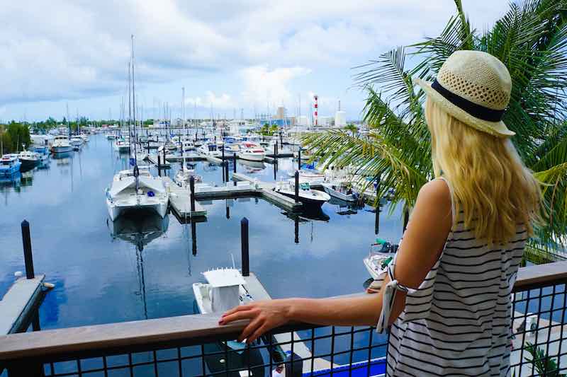 Blond Woman looking at a boat club in Central Florida