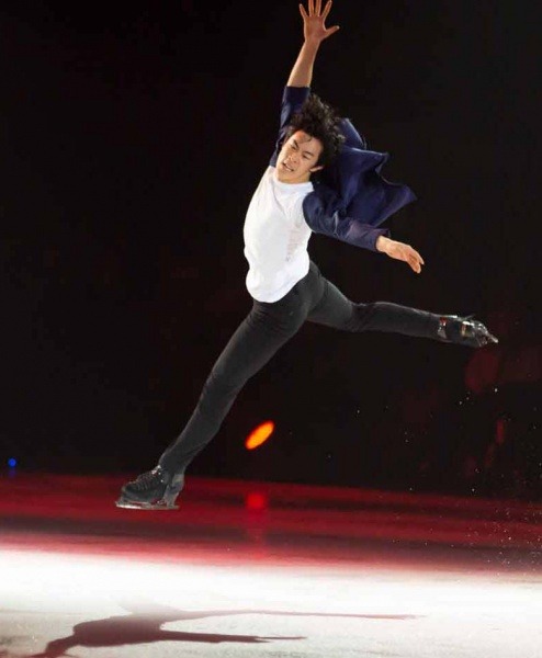 Gold medal winner Nathan Chen doing a jump during a performance