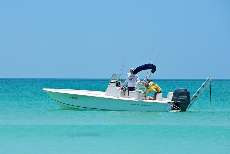 A group of men fishing on a boat in Florida