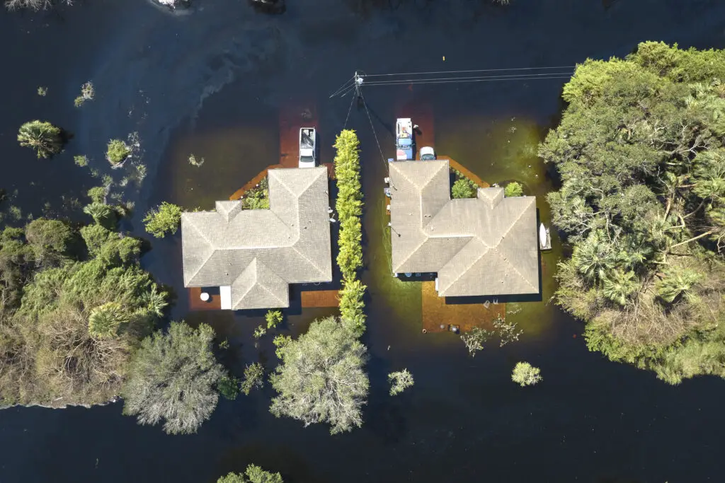 Aerial view of two homes surrounded by water after Florida Hurricane Ian